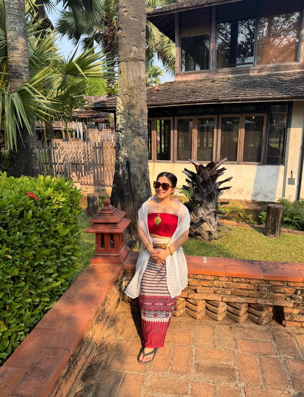 Leona in a traditional Thai outfit outdoors